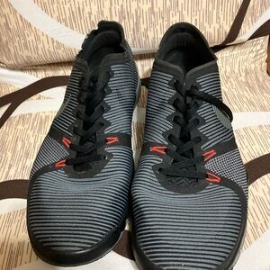 Nike Black and Gray Athletic Shoes with Ribbed Texture and Sleek Design